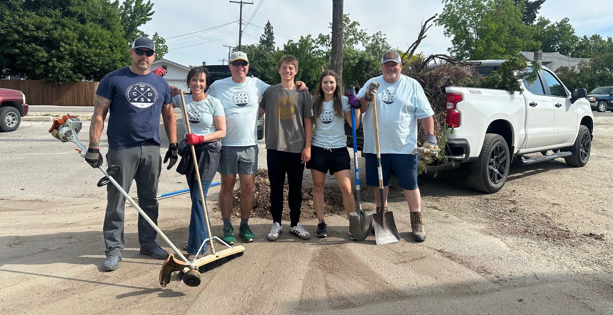 Windermere team standing for a photo on their annual community service day.