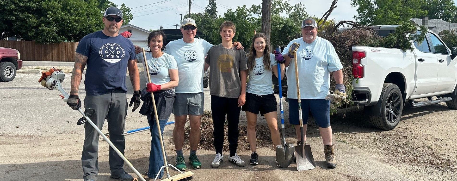 Windermere team standing for a photo on their annual community service day.