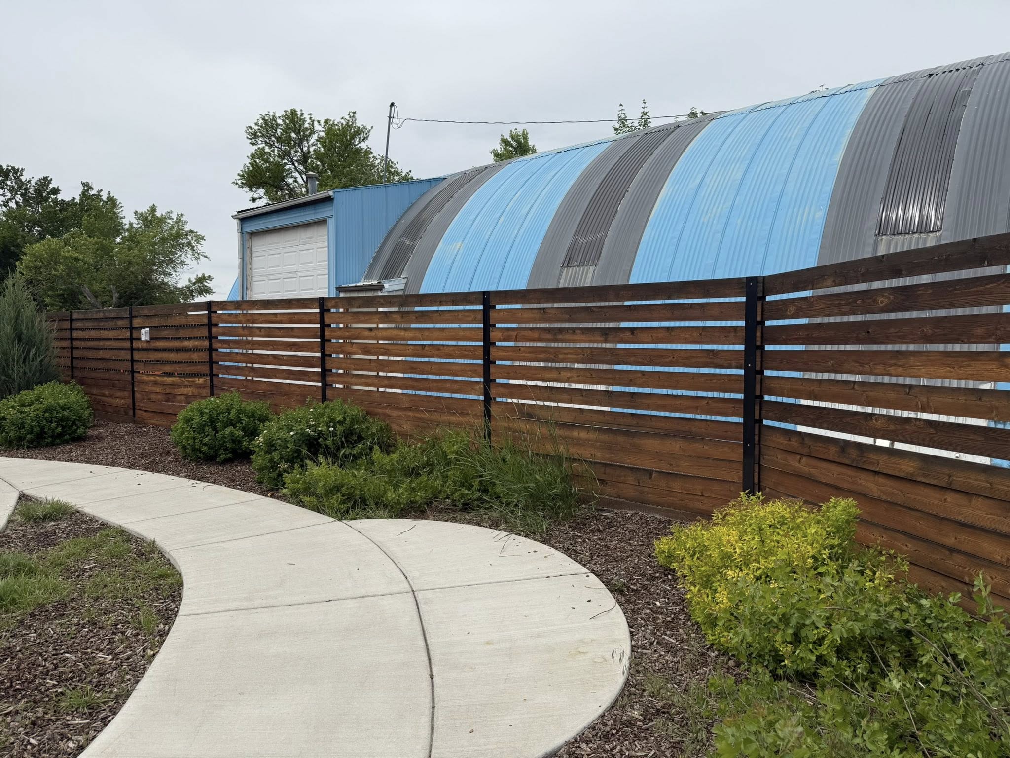 Fence stained by the Windermere team on their annual community service day. 