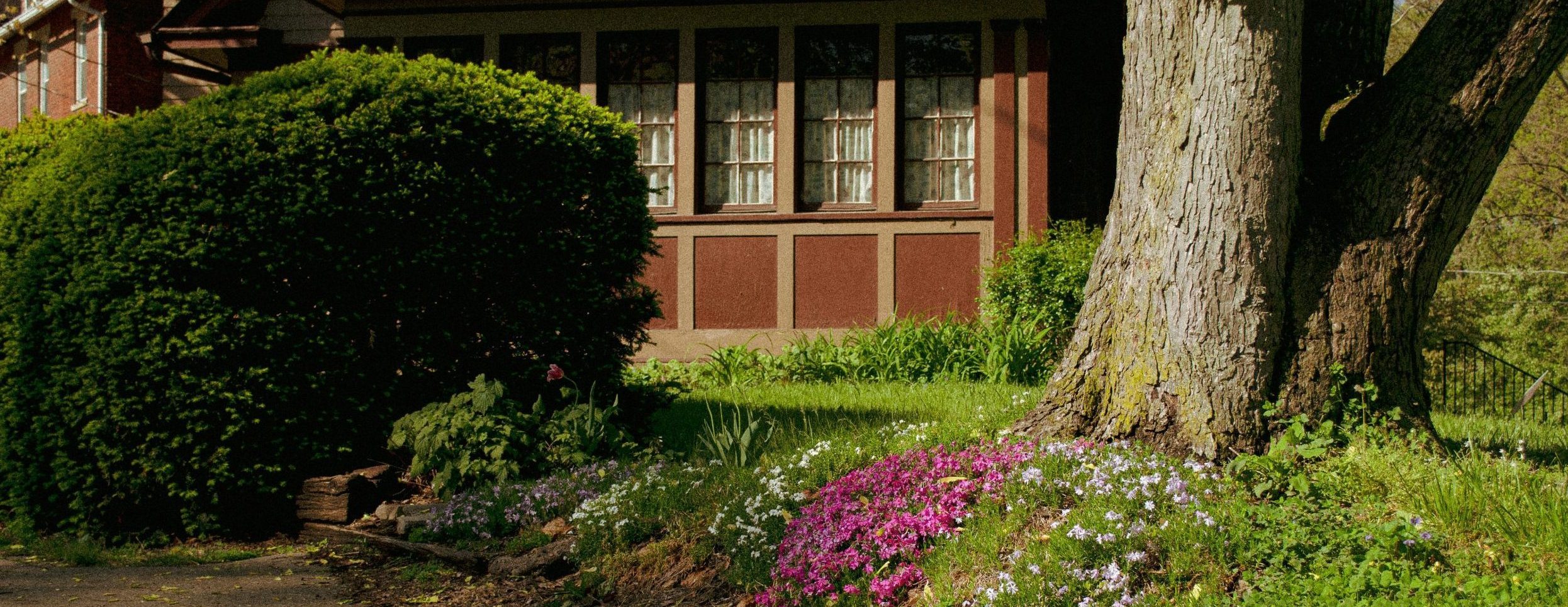 Facing a home with some spring flowers in front of it
