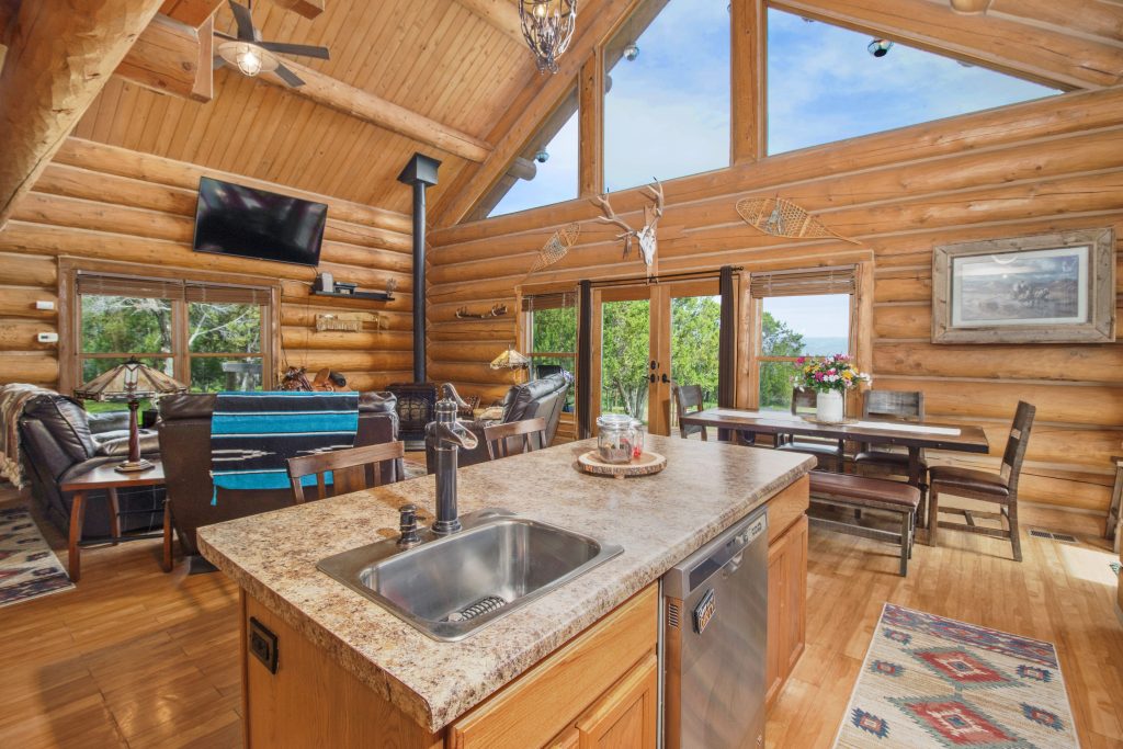 Interior of cabin kitchen in the mountains. A possible property that can be purchased with local expertise with Windermere.